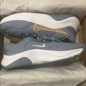 Nike Gray and White Sneakers with Orange Swoosh